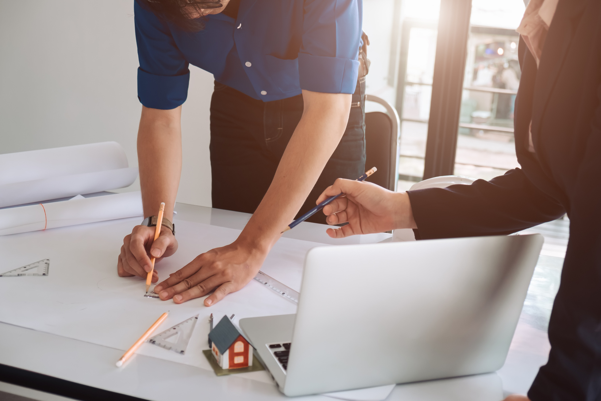 Architects Working on Blueprint Construction Project